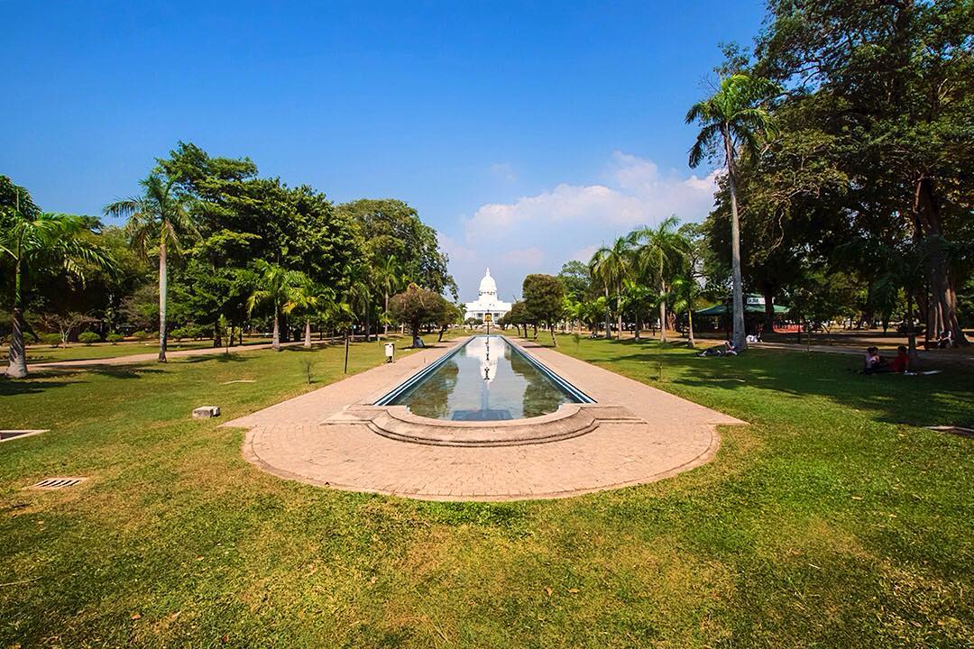 The calm and tranquil Viharamahadevi Park in Sri Lanka's chaotic capital city, Colombo.⠀
⠀
Colombo isn’t as frenetic as other Asian capitals (Delhi, Bangkok, Phnom Penh), but nor is it a quiet city. Find a spot of calm at Viharamahadevi Park with its trim lawn, leafy trees and sizeable Buddha statue.⠀
⠀
The park is Colombo’s oldest and largest, and was formerly known as Victoria Park named after Britain’s Queen Victoria. It was renamed in the 1950s to honour the mother of King Dutugemunu, the Sinhalese king of Sri Lanka who reigned from 161 BC to 137 BC.⠀
⠀
Today, the park provides the perfect spot from which to watch ambling locals, tired tourists and even a wedding party or two. We stayed nearby at the equally calm and tranquil @taruvillas' Lake Lodge.⠀
⠀
#SriLanka #lka #Lanka #ceylon #IndianOcean #ocean #Colombo #Galle #bentotabeach #beach  #travel #sunset #travelgram #wanderlust #vacation #instatravel #view #travelphotography