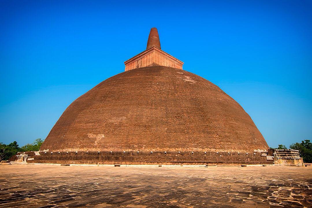 Not a cloud in the sky or a tourist on the ground at the Abhayagiri Dagaba in Anuradhapura in Sri Lanka.⠀
⠀
Anuradhapura is one of the ancient capitals of Sri Lanka and has some the best-preserved ruins of ancient Sri Lankan civilisation. 
We visited in February this year and hired bicycles to get around the sprawling complex. We were amazed to find some of the most popular sights completely empty. We did get up early to make the most of the day, but never expected to have one of the most impressive sights of the whole complex all to ourselves. ⠀
⠀
#Anuradhapura #SriLanka #lka #ruins #travel #Sri_Lanka #photo #VisitSriLanka #Ruwanwelisaya  #Lanka #ceylon #IndianOcean #ocean #srilankaecotourism #Abhayagiri #Dagaba #stupa #pagoda #travelgram #wanderlust #vacation #instatravel #adventure #view #travelphotography #BBCTravel #rgphotobook