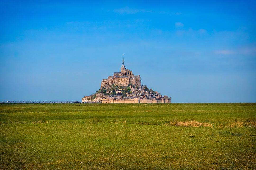 The magnificent island commune of Mont-Saint-Michel seen from the surrounding grassland on the coast of Normandy in France.⠀
⠀
The tidal island along with its monastery and fortifications can be seen from miles along the coast and is one of France's most recognisable landmarks. ⠀
⠀
We were heading back to our home in France and thought we'd stop off to visit the UNESCO World Heritage Site along the way. We were lucky to be blessed with perfect weather for our visit.⠀
⠀
#MontSaintMichel #Normandie #France #MagnifiqueFrance #Manche #travel #Normandy #TDF2016 #Castle #Bretagne #BeautifulFrance #travel #travelgram #wanderlust #vacation #instatravel #adventure #view #travelphotography #BBCTravel #RGphotobook #roadtrip