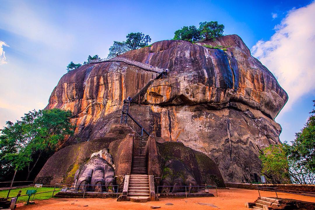 Two giant lion paws guard the gateway to Sigiriya Rock Fortress which rises from the bedrock in the central plains of #SriLanka.⠀⠀
⠀
It’s said that the fortress was built over 1,000 years ago by parricidal king Kasyapa who buried his father alive in a wall before commandeering the throne. Kasyapa died a violent death in 495 AD after which the fortress was used as a Buddhist monastery.⠀
⠀
Today, Sigiriya Rock Fortress is a UNESCO listed World Heritage Site. Visitors can climb the 1,200 steps – many of which are bolted onto the rockface – to explore one of the best preserved examples of ancient urban planning. ⠀
⠀
#bbctravel #Sigiriya #SigiriyaRock #LionRock #rock #Ancient #parque #NumberGuessing #lka #Lanka #ceylon #IndianOcean #ocean #srilankaecotourism #travel #sunset #sunrise #travelgram #wanderlust #instatravel #adventure #view