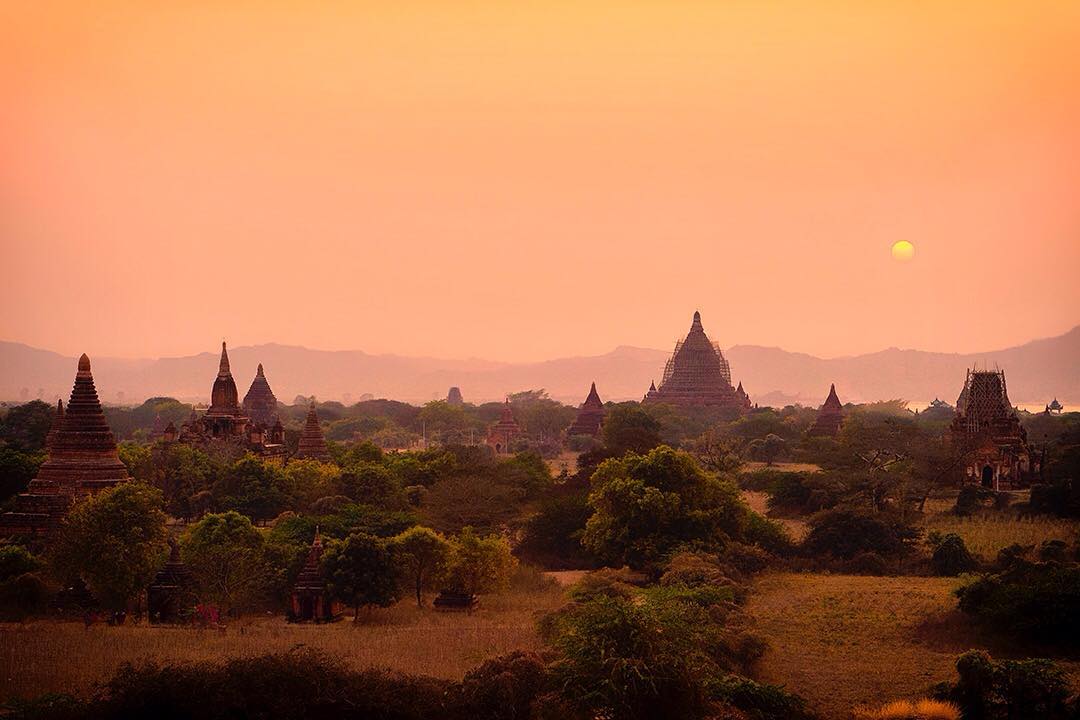 A setting sun lingers over the iconic stupas of the ancient city of Bagan in Myanmar.⠀⠀
⠀
Sprawling across an area of 26 square miles, Bagan is the world's largest and densest concentration of Buddhist temples, pagodas, stupas and ruins. We arrived after cycling 60km from Mount Popa on a cycle tour with @gadventures and @lonelyplanet. We were feeling somewhat templed out but our first view of Bagan had us eager to explore once more. ⠀
-⠀
-⠀
-⠀
-⠀
-⠀
-⠀ #liveoutdoors #awesomepix #ourlonelyplanet #travelawesome #passionpassport #lpPathfinders #Bagan #Myanmar #Burma #Mandalay #light #mystic #temples #pagoda #stupa #travelgram #wanderlust #instatravel #adventure #tranquility #Burmese #neverstopexploring #keepitwild #thegreatoutdoors #backpacking #adventurethatislife⠀