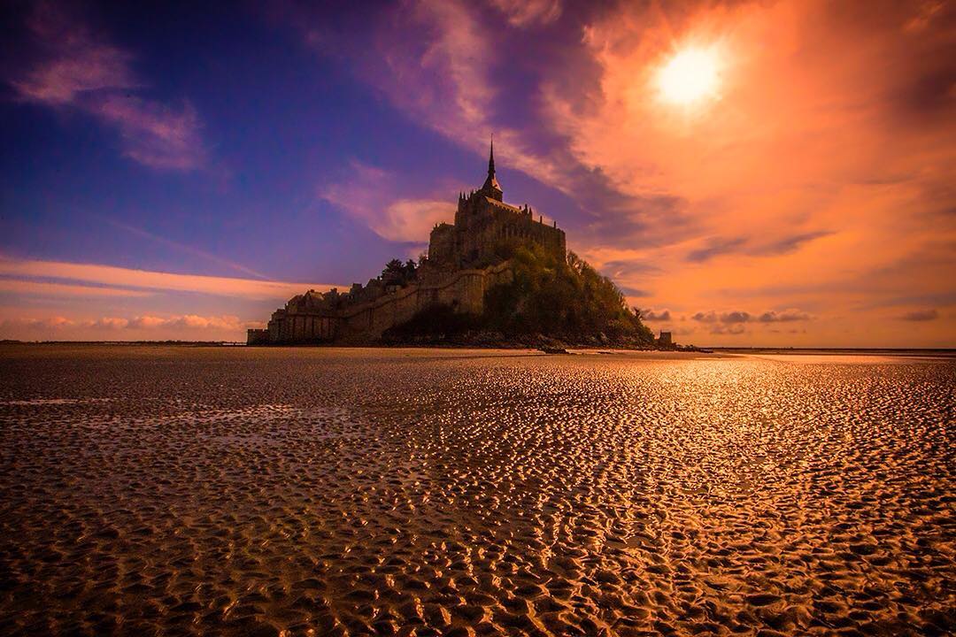 The silhouetted island commune of Mont-Saint-Michel at low tide just before #sunset off the coast of Normandy in France.⠀
⠀
The tidal island along with its monastery and fortifications look fantastic from the mudflats at low tide. Low tide currently coincides with the setting sun making for some stunning scenes from the saturated mudflats. ⠀
⠀
We were heading back to our house in France and thought we'd stop off to visit the iconic UNESCO World Heritage Site along the way.
⠀
#MontSaintMichel #Normandie #France #MagnifiqueFrance #Manche #travel #Normandy #TDF2016 #Castle #Bretagne #BeautifulFrance #travel #travelgram #wanderlust #vacation #instatravel #adventure #view #travelphotography #BBCTravel #RGphotobook #roadtrip