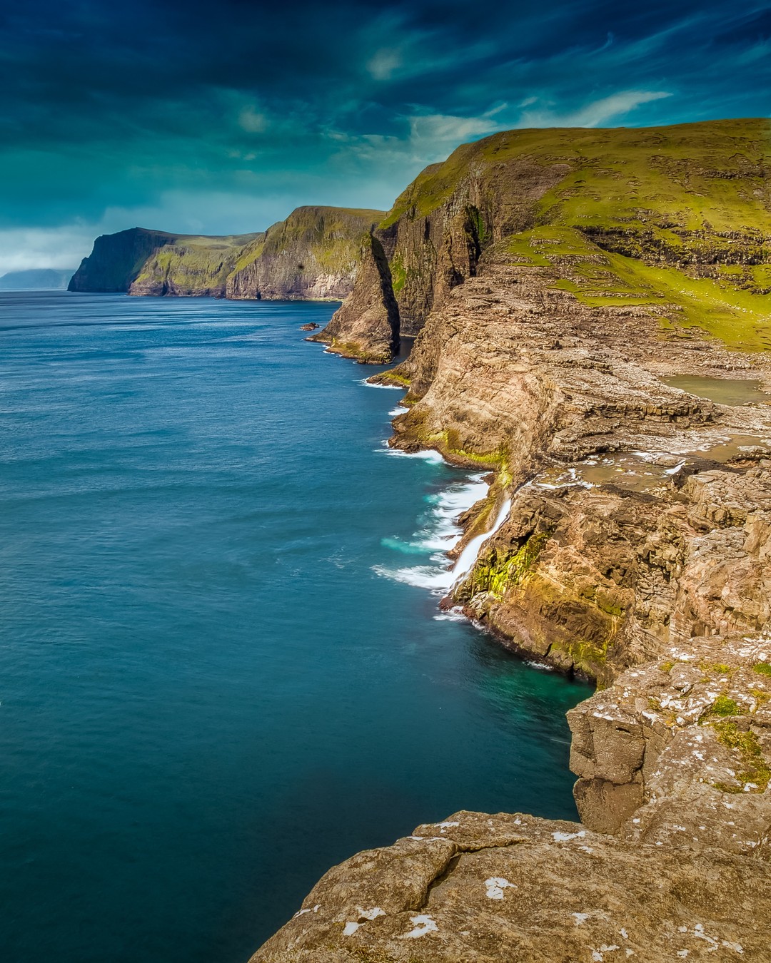 The Faroese coast is never anything but sensational.

One of the most popular hikes in the Faroe Islands is the hike along the shores of Lake Sørvágsvatn. The trail takes in a number of impressive viewpoints en route to Bøsdalafossur waterfall – where Sørvágsvatn drains into the Atlantic Ocean – and the distinctive sea stack of Geitisskoradrangur. 
-⠀⠀⠀⠀
-⠀⠀⠀⠀
-⠀⠀⠀⠀
-⠀⠀⠀⠀
-⠀⠀⠀⠀
-⠀⠀
#Geitisskoradrangur #Sørvágsvatn #SørvágsvatnLake #LakeSørvágsvatn #visitfaroeislands #atlanticairways #faroes #faroe #Bøsdalafossur #trælanípa #vagar #leitisvatn @visitfaroeislands
