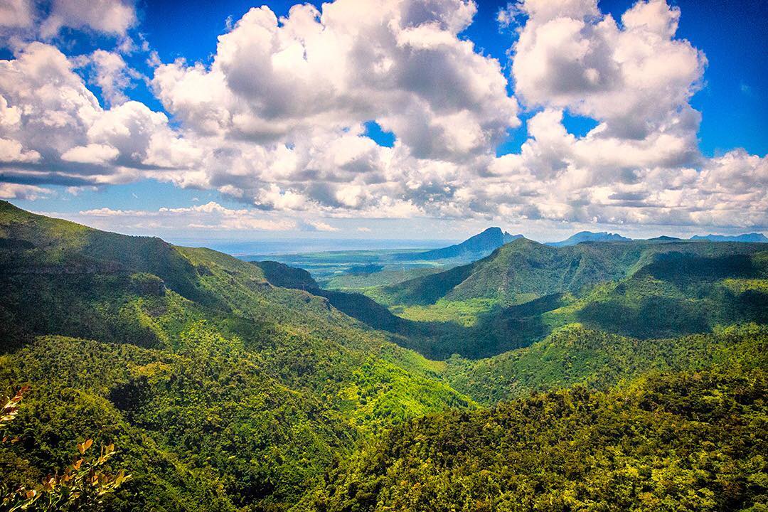 White clouds and dark shadows roll across the valleys at Gorges Viewpoint in Black River Gorges National Park in Mauritius. ⠀
⠀
The park covers 2% of the island and is by far the best protected area in Mauritius. In many ways, it is the last stand for the country's forests and native species; the wild expanse of verdant hills and thick forest is one of the few places protected from hunting, farming and invasive species.⠀
⠀
If you make only one day trip from the coast, make it to Black River Gorges National Park. Located in the south-western part of Mauritius it is easily accessible form every part of the island. We drove the 30 minutes from our @beachcomber_hotels in Blue Bay. ⠀
⠀
#BlackRiverGorgesNationalPark #BlackRiver #Mauritius #Mauritius #travel #ilemaurice #beach #Africa #Indian #BeachcomberExperience #indianocean #paradise #islandparadise #wanderlust #igersmauritus #sky #amazing #summertime #sunset #nature
