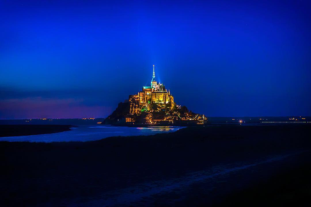 Normandy’s fantastical and fairytale Mont Saint-Michel illuminated at night.⠀
⠀
When it comes to French architecture, there are myriad contenders for the throne. The most notable is the Eiffel Tower, a world-famous symbol of Gallic ingenuity. Then there’s the Louvre, possibly the most famous museum in the world. After that we have the Notre Dame and, in any chosen order, the Arc de Triomphe, Sacre Coeur, Palace de Versailles and the Pantheon.⠀
⠀
Less famous but more impressive is Mont Saint-Michel, Normandy’s abbey on a rock in a bay. If you do visit, make sure you explore after dark – inside and outside its walls. ⠀
⠀
We visited @mont_stmichel in April this year with @brittanyferries.⠀
-⠀⠀
-⠀⠀
-⠀⠀
-⠀⠀
-⠀⠀
-⠀⠀⠀
#MontSaintMichel #Normandie #France #MagnifiqueFrance #Manche #Normandy #Castle #Bretagne #BeautifulFrance #lpPathfinders #adventureawaits #adventureculture #traveldeeper #hikingadventures ⠀⠀
#wellhiked #stayandwander #takeahike #travelawesome #optoutside #getoutstayout #ic_adventures #global_hotshotz #lpfanphoto