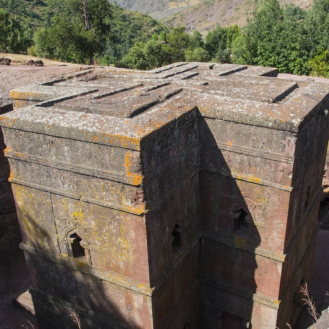 The cruciform roof of the rock-hewn church of Bet Giyorgis (St George) in Lalibela, #Ethiopia. ⠀
⠀
The churches of Lalibela have no bricks, no blocks and no evidence of joints. Instead, they are carved out of single solid chunks of pink volcanic rock. The 13th-century labourers would initially dig down into an outcrop, carving a trench around a single giant block of rock, and then hew the church from that monolith.⠀
⠀
Legend has it that the thousands of labourers who toiled on Lalibela’s “New Jerusalem” by day were matched by angels who continued the work by night.⠀
-⠀
-⠀
-⠀
-⠀
-⠀
-⠀
-⠀
#Lalibela #rockhewn #cruciform #church #amazingafrica #visitethiopia #africa #ethiopian #everydayethiopia #everydayafrica #Abyssinia #exploretocreate #ethiopianchurch #beautifuldestinations#Ethiopianadventure #neverstopexploring #keepitwild #thegreatoutdoors #lpfanphoto #lpPathfinders