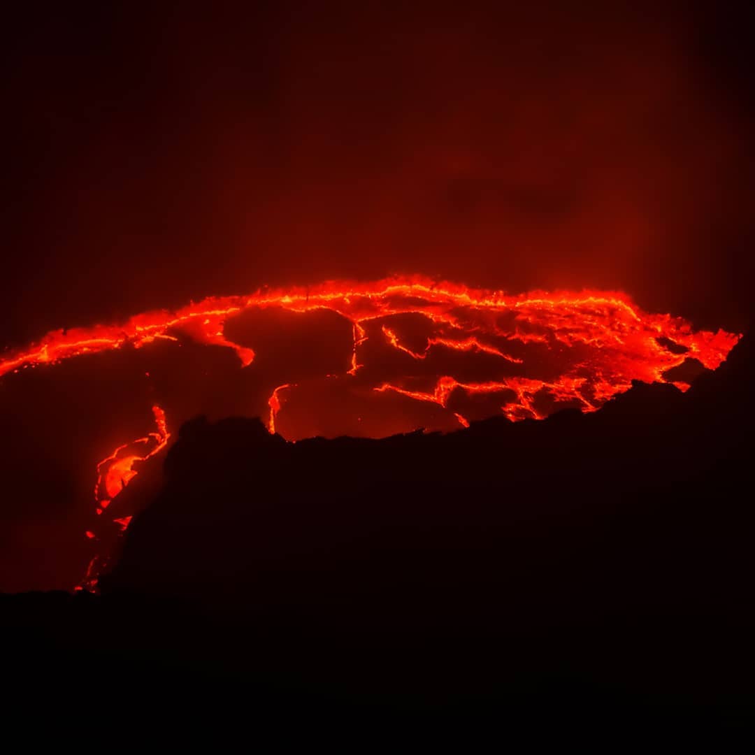 The world’s longest-existing lava lake, Erta Ale volcano in #Ethiopia. ⠀
⠀
It is one of the most active volcanoes in the world and was everything we envisioned: livid, fearsome, incandescent. The lava blistered and erupted, and made us screech in wonder.⠀
⠀
The lava on Erta Ale is not concentrated in a single vent; it oozes, flows and erupts across a vast amount of space. We spent an age watching it, filming it, committing it indelibly to memory. ⠀
⠀
After an hour, Erta Ale smoked over – appropriate given its name: “smoking mountain” in the local Afar language. Satisfied that the risk, effort and expense of reaching the rim had paid off, we packed up our equipment and returned to camp.⠀
-⠀
-⠀
-⠀
-⠀
-⠀
-⠀
#ErtaAle #ErtaAlevolcano #volcano #Danakil #DanakilDepression #Afar #AfarRegion #volcanoes #lava #africa #sunrise #rift #liveoutdoors #awesomepix #ourlonelyplanet #travelawesome #danikaldesert #hottestplace #hottestplaceonearth #extemeheat #optoutside #neverstopexploring #keepitwild #thegreatoutdoors