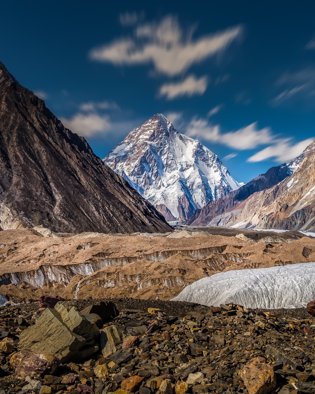A long-exposure of #K2 in #Pakistan 🇵🇰. At 8,611m (28,251ft), K2 is the second-highest mountain in world – only Everest in Nepal is higher. However, K2 has a symmetry and grace that in my mind, makes it the most striking of the 14 eight-thousanders. ⁣
⁣
After nine days of trekking with @losthorizontreks we finally got our first view of the “Savage Mountain”. Still over 12km away, K2 rose above the surrounding mountains, its towering presence utterly overwhelming.

Flanked by five of the world's 17 highest mountains, K2 soars in proud isolation over its neighbours. It is an awesome, frightening mountain.
-⠀
-⠀
-⠀
-⠀
-⠀
#k2basecamp #k2basecamptrek #k2trek #Karakoram #Pakistan #concordia #k2peak #himalayas #gilgitbaltistan #baltoro #BaltoroGlacier #beautifulpakistan #travelpeacefulpakistan #gondogorola #gondogorolapass #gondogorolatrek #gondogoropass #lonelyplanet #lppathfinders #karakoramrange #viewsofpakistan #incrediblepakistan #incrediblehunza #naturepakistan #destinationpakistan #tkcinsta #thekarakoramclub #dawndotcom