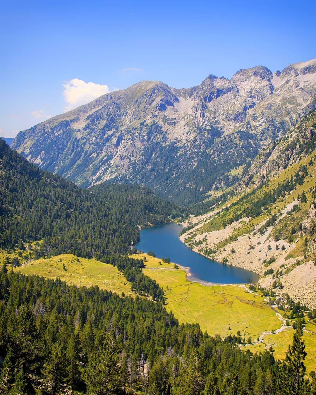 This view from Aigüestortes and Lake Sant Maurici National Park in the @valldeboi area of the Catalan Pyrenees has a bit of everything we love: mountains, meadows, forests and lakes. ⠀
⠀
We picked a perfect day for hiking across the stunning park during our mystery trip to the region with @visitpirineus, @catalunyaexperience and @outdooradventour.⠀
-⠀⠀
-⠀⠀
-⠀⠀
-⠀⠀
-⠀⠀
-⠀⠀
#catalunyaexperience #visitpirineus #valldeboi #onelspirineustoquenelcel #dondelospirineostocanelcielo #aiguestortes #aigüestortes #pnaiguestortes #parquenacionalaigüestortes #parcnacionalaigüestortes #aiguestortesnationalpark #aigüestortesiestanydesantmaurici #catalunya #catalonia #viewfromthetop #liveoutdoors #neverstopexploring #keepitwild #thegreatoutdoors #wellhiked #stayandwander #takeahike #hikingadventures #getoutstayout #lppathfinders