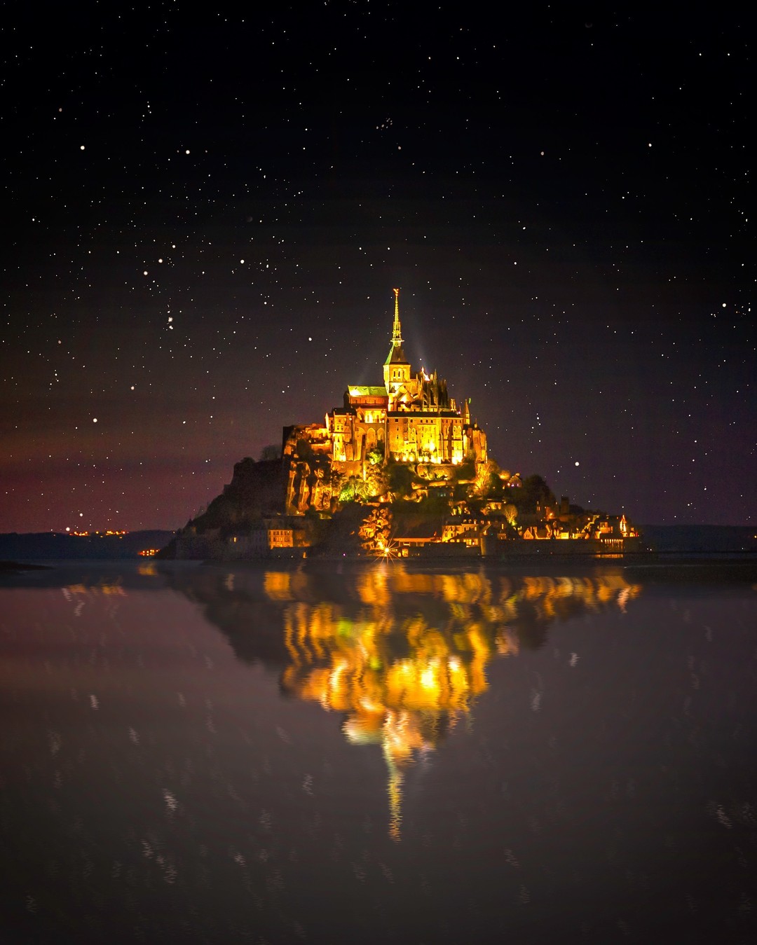 The fairytale complex of Mont Saint-Michel in Normandy, France, dates as far back as the 8th century. ⁣
⁣
Legend has it that the archangel Michael appeared in 708 to the bishop of Avranches and instructed him to build a church on the rocky islet. A monastery and abbey were erected over subsequent centuries, complete with fairytale flourishes: soaring spires and hulking ramparts that rise dramatically from the sea.⁣
⁣
Mont Saint-Michel is famed for its tidal variations. It offers extraordinary views even when the tide is out, but when the tide is in and night descends, the magic truly happens. We explored eerily empty alleys and pathways late into the evening where all was quiet but the wishing of the waves.⁣
-⁣
-⁣
-⁣
-⁣
-⁣
-⁣
#MontSaintMichel #Normandie #France #MagnifiqueFrance #Manche #Normandy #Castle #Bretagne #BeautifulFrance