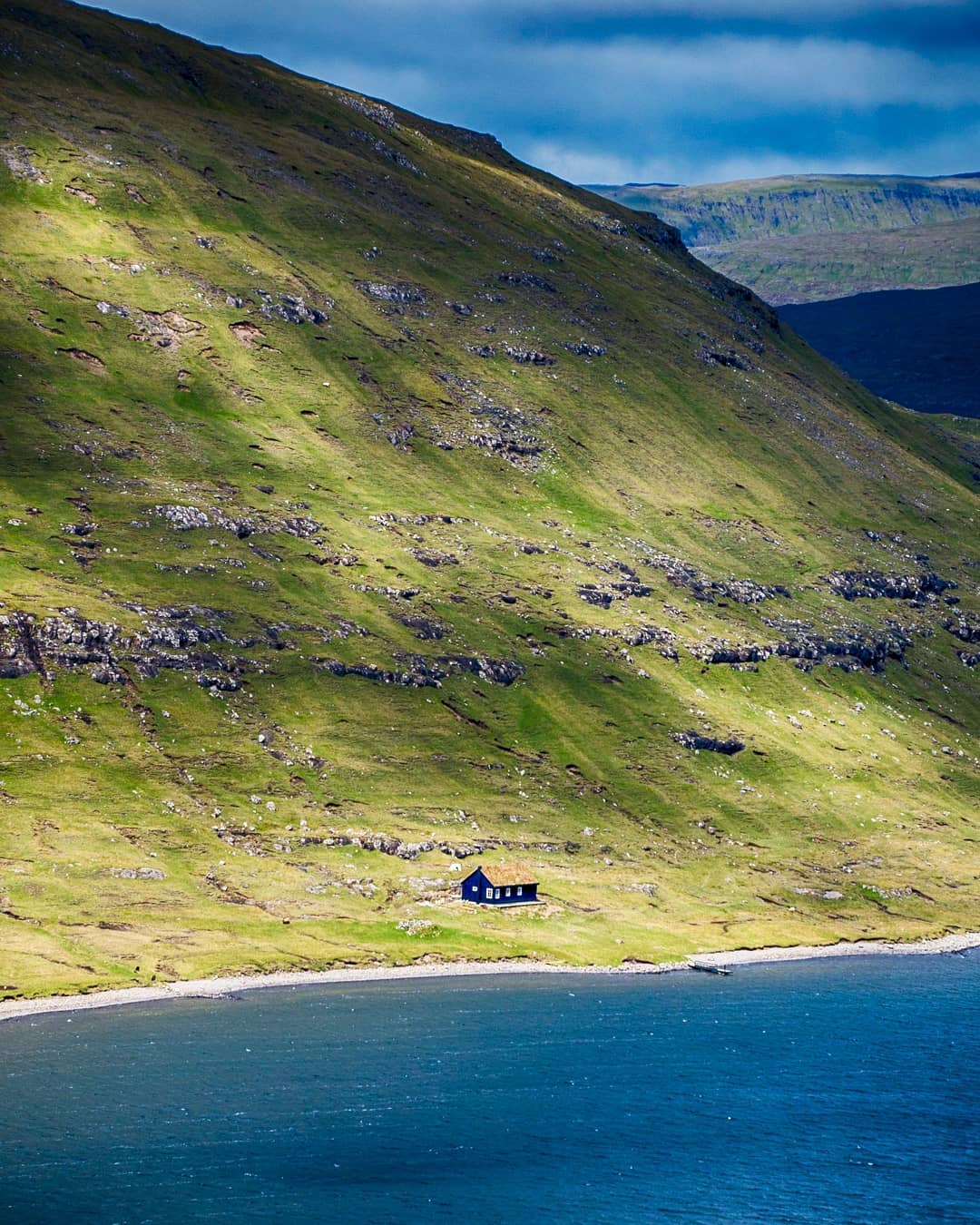 A lonely dwelling by the shores of Sørvágsvatn Lake – where the largest lake in the Faroe Islands stretches into ocean.⠀
⠀
We sent a day hiking one of the most popular hikes in the Faroes along the shores of Lake Sørvágsvatn to the viewpoints at #Trælanípa and #Bøsdalafossur waterfall. The trail skirts the lake, which is the largest in the Faroe Islands, before branching off up the Trælanípa escarpment.⠀
⠀
Trælanípa (Slave Cliff) supposedly got its name from when Vikings pushed their unwanted slaves into the ocean.⠀
⠀
We visited the Faroe Islands with support from @visitfaroeislands.⠀⠀⠀⠀
-⠀⠀⠀⠀
-⠀⠀⠀⠀
-⠀⠀⠀⠀
-⠀⠀⠀⠀
-⠀⠀⠀⠀
-⠀⠀
#Sørvágsvatn #SørvágsvatnLake #LakeSørvágsvatn #visitfaroeislands #atlanticairways #faroes #faroe #lonelyplanet #lppathfinders #rgphoto