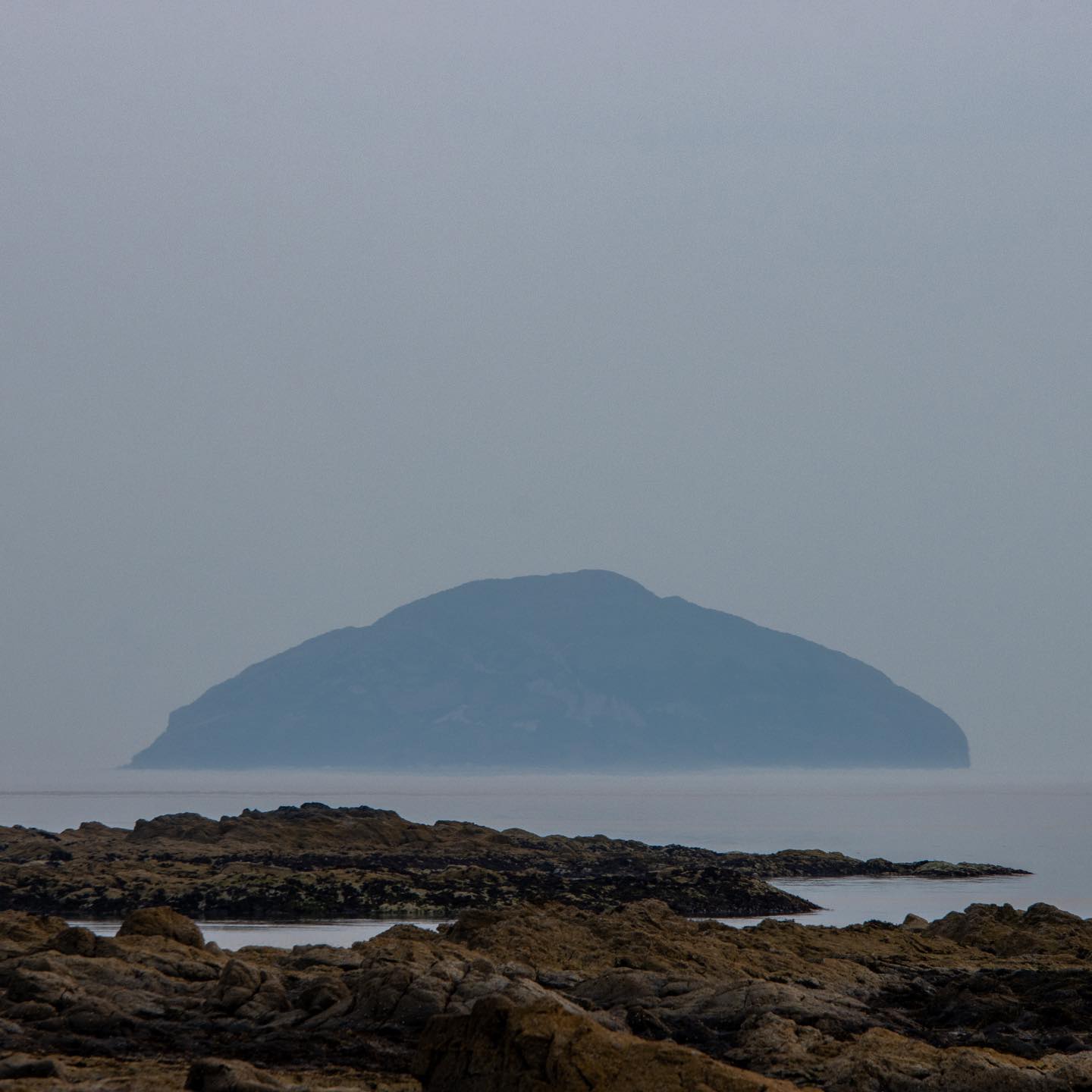Ailsa Craig from maidens, Ailsa Craig is an island of 99 hectares (240 acres) in the outer Firth of Clyde, 16 kilometres (10 miles) west of mainland Scotland, upon which blue hone granite has long been quarried to make curling stones. The now uninhabited island is formed from the volcanic plug of an extinct volcano.
