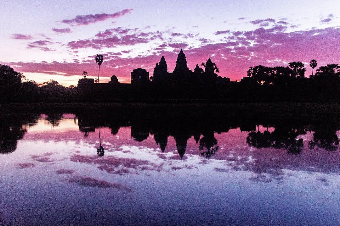Angkor Wat during sunrise this morning 😍

Angkor Wat is a temple complex in Cambodia and one of the largest religious monuments in the world. It was originally constructed as a Hindu temple dedicated to the god Vishnu for the Khmer Empire, gradually transforming into a Buddhist temple towards the end of the 12th century.

As the best-preserved temple at the site, it is the only one to have remained a significant religious centre since its foundation. The temple is at the top of the high classical style of Khmer architecture. It has become a symbol of Cambodia, appearing on its national flag 🇰🇭, and it is the country's prime attraction for visitors.
.
#angkorwat #angkorwattemple #angkorwatsunrise #siemreap #cambodia #pinksky #temple #wat #asia #khmer #worldheritage #unescoworldheritage #sunrise #sun #travel