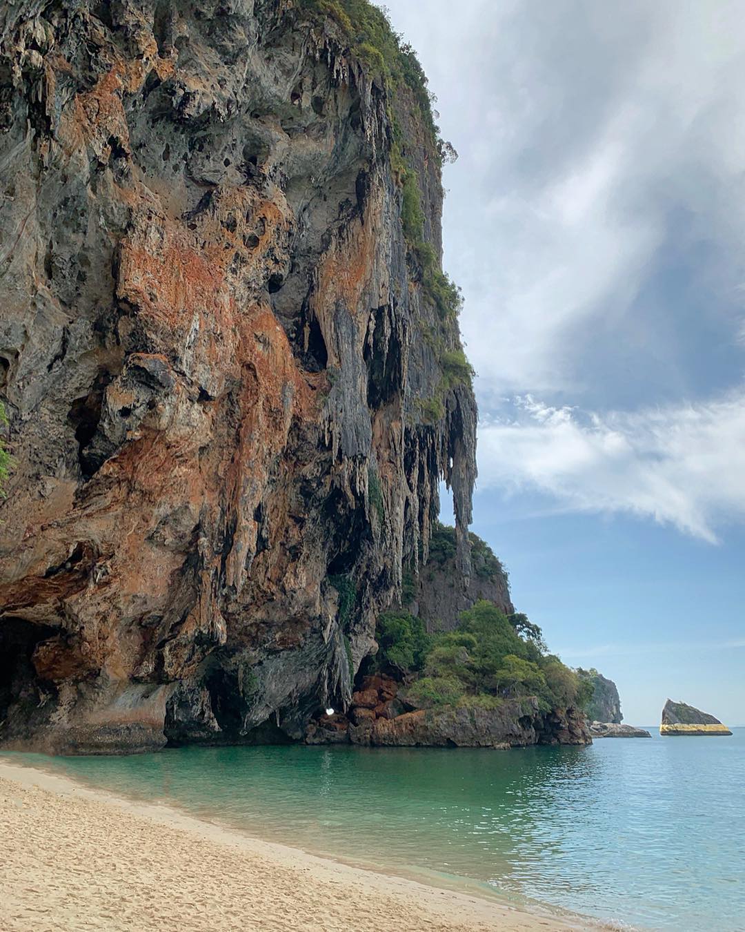 Phra Nang Beach is surrounded by stunning limestone cliffs and is located on the southern most tip of the Railay Peninsula. It's the southern strip of sand in Railay Bay. With 450 metres in length, and reachable in a mere 20-minute long-tail boat trip directly from Ao Nang.
.
#phranangbeach #railaybeach #railaybay #aonang #thailand #travel #beach #sun #sea #beautifulplace #limestonecliff #krabi